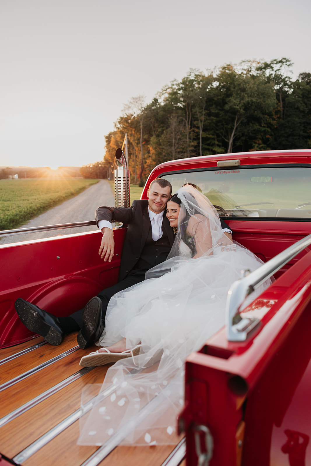 Sunset couple portrait in vintage vehicle