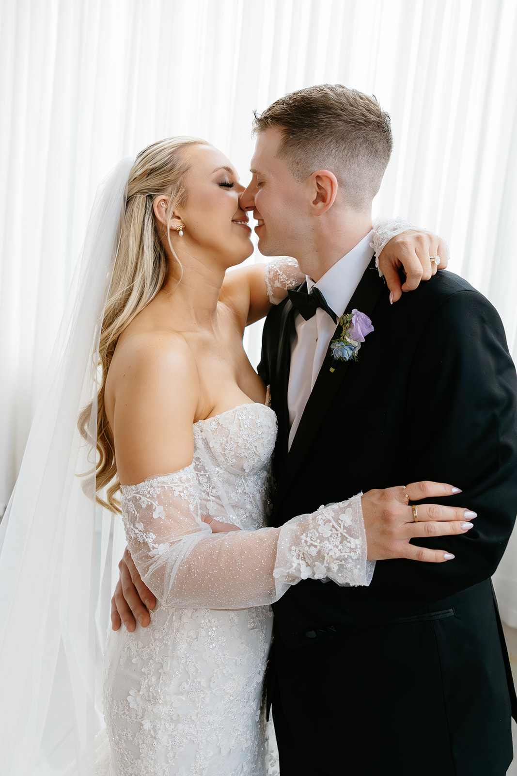 bride and groom portrait of them kissing at their rochester ny wedding venue The Highline
