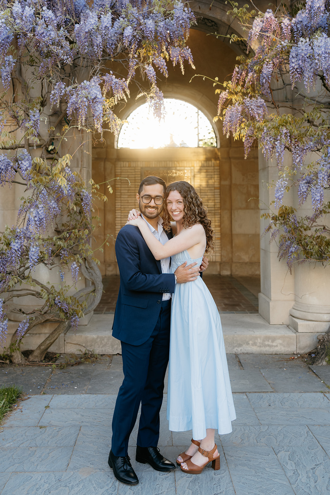 happy engagement photo at sunset at George Eastman Garden in Rochester NY