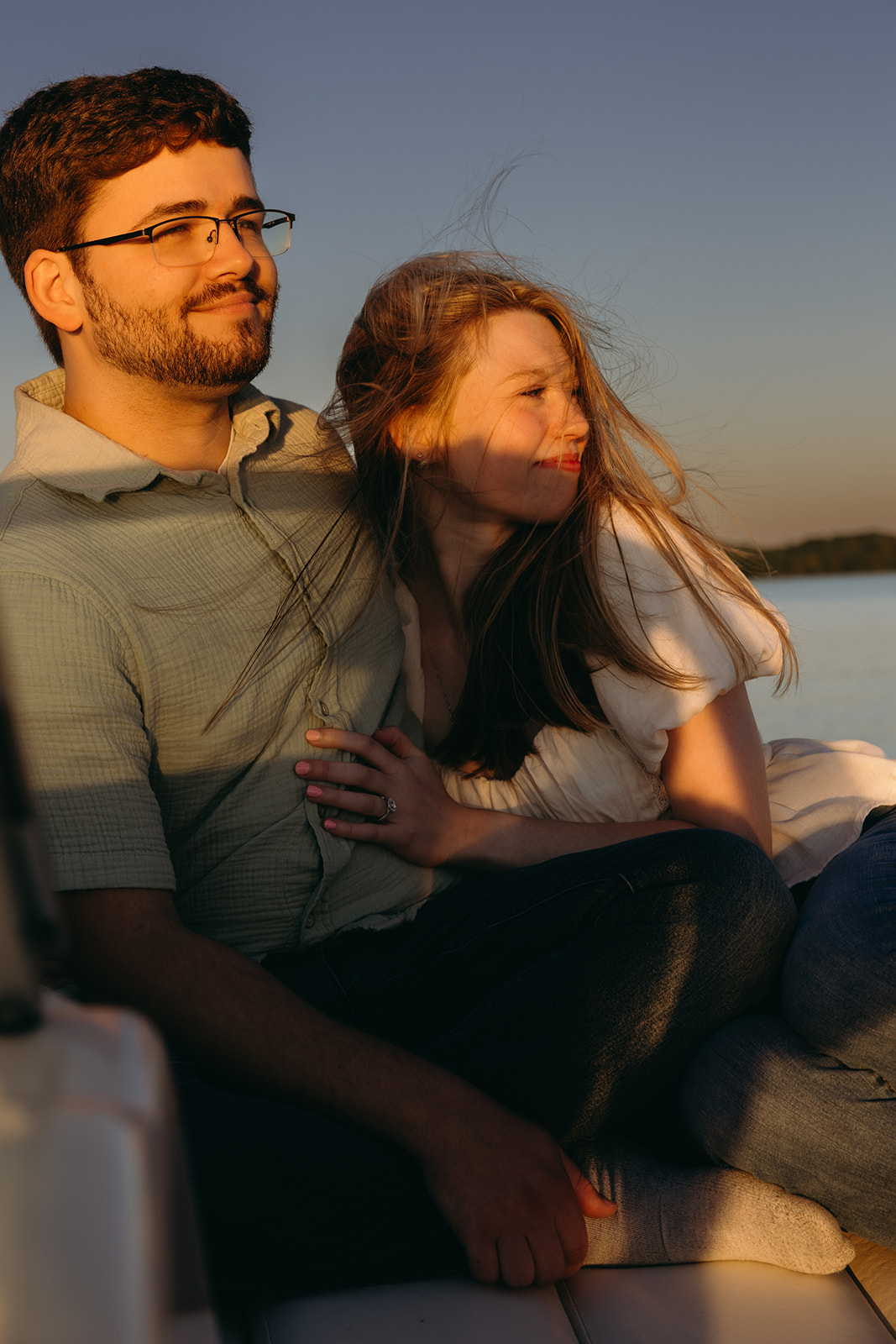 couple on a boat on a lake