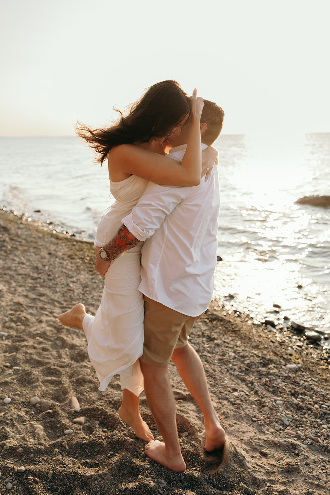engagement session at a beach at sunset