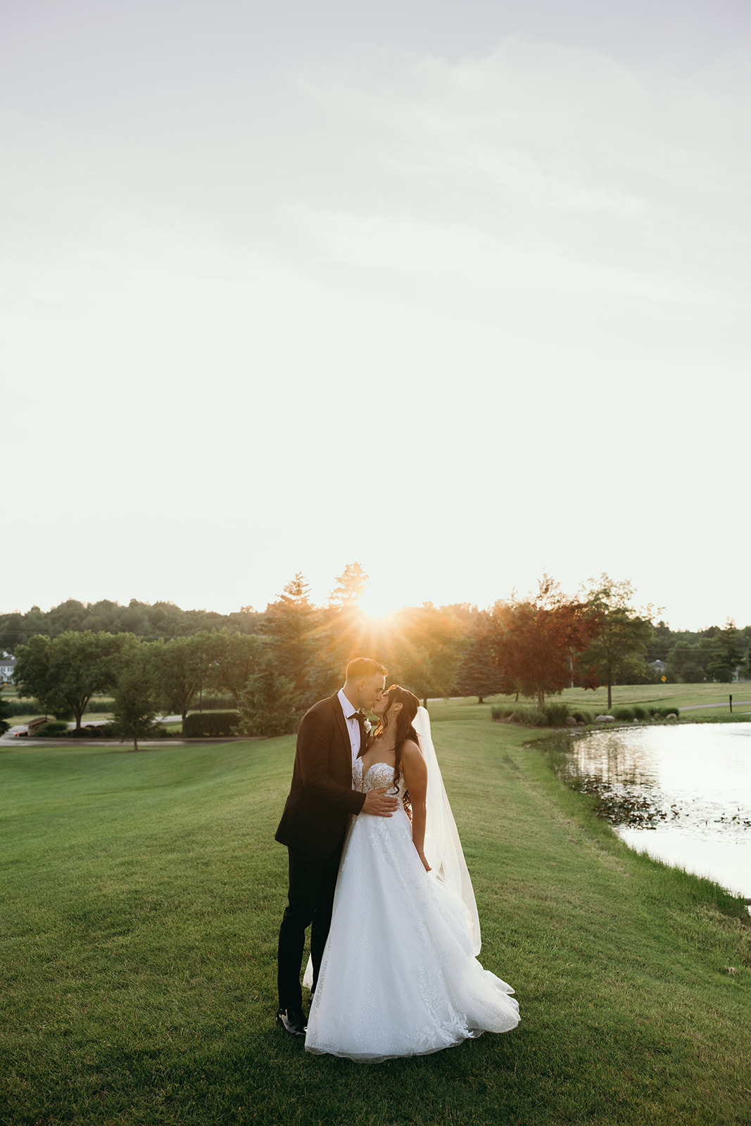 bride and groom at sunset at golf club