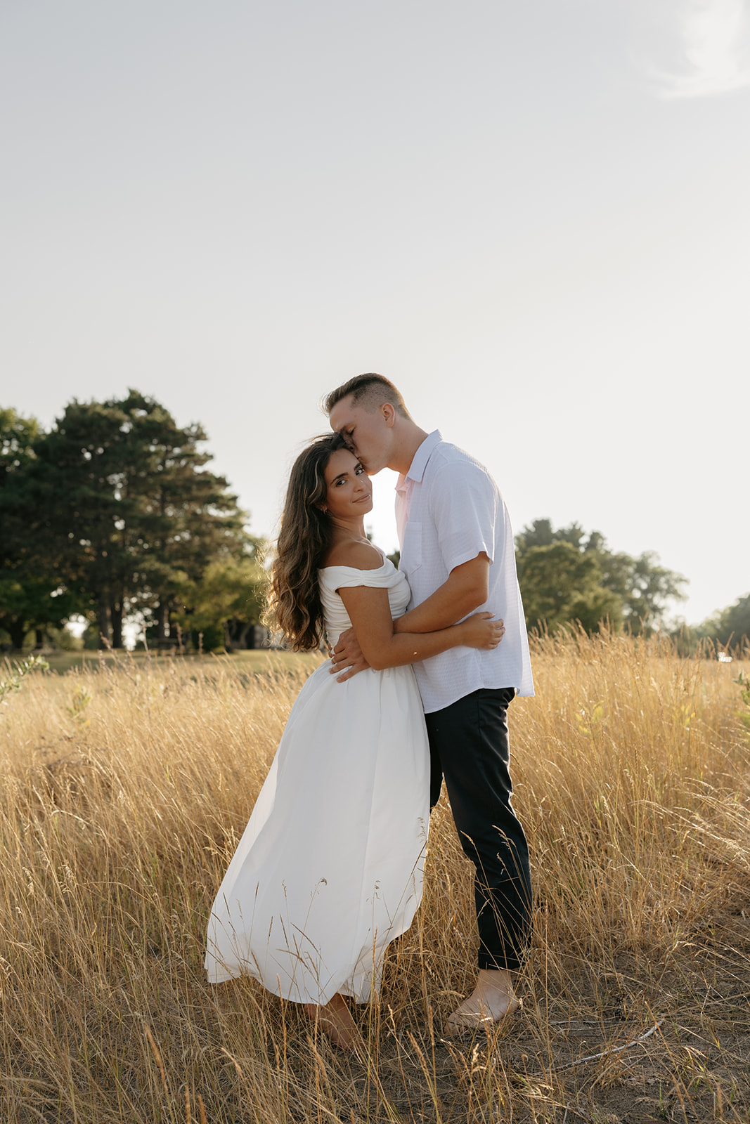 beach engagement session couple photo at sunset