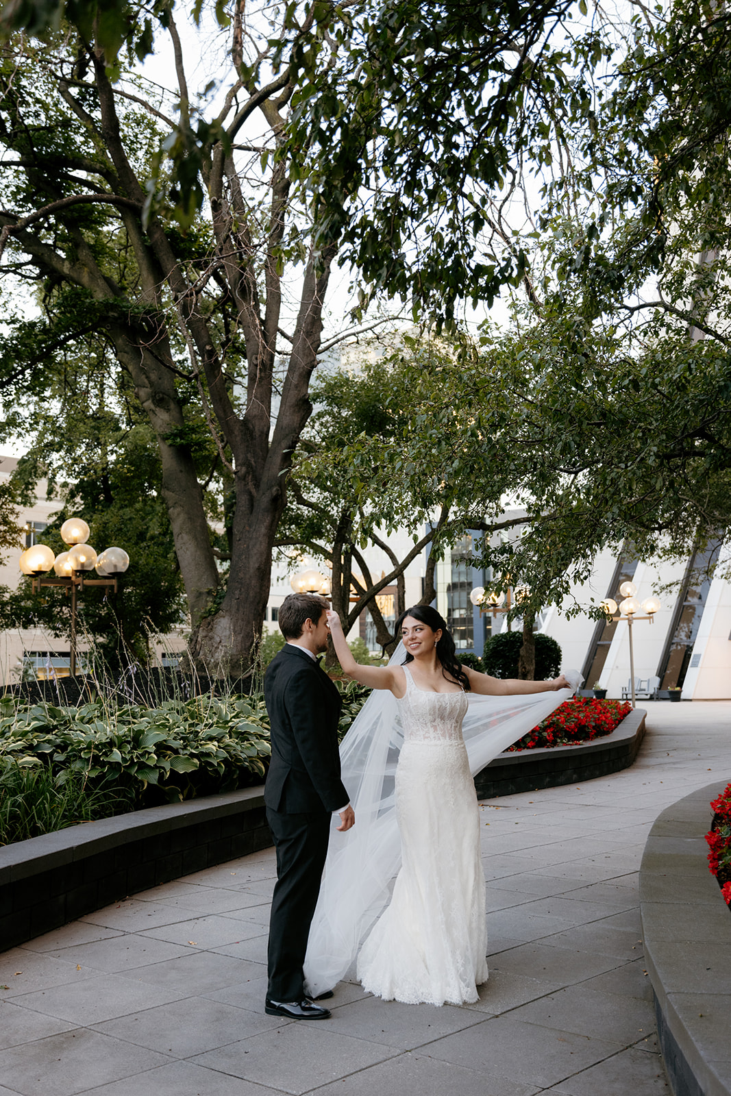 bride and groom portrait in rochester ny outside of arbor midtown at sunset