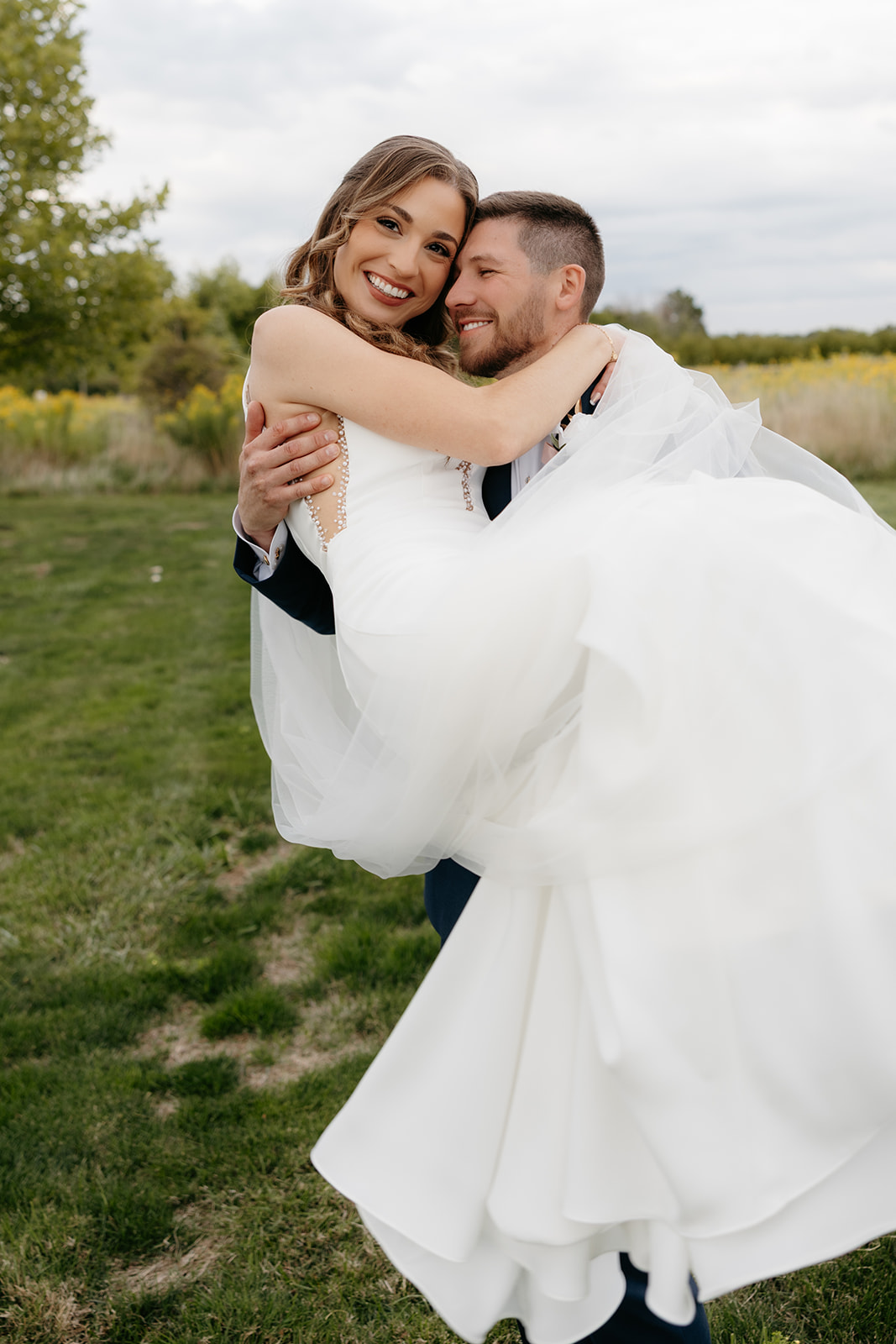 bride and groom candid moment during sunset photos